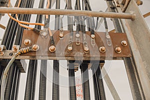 Photo of a busbar that has cable and ground wire connected.