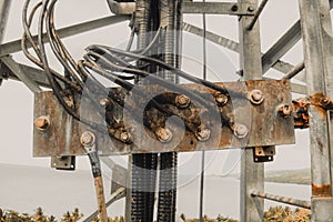 Photo of a busbar that has cable and ground wire connected.