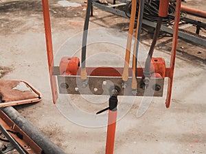 Photo of a busbar that has cable and ground wire connected.