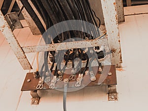 Photo of a busbar that has cable and ground wire connected.