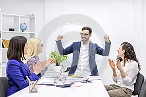 Photo of business people having meeting in modern office.