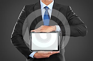 Photo of a businessman showing blank tablet PC monitor