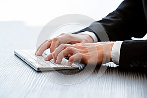 Photo businessman typing message, hands keyboard. Blurred background - Image