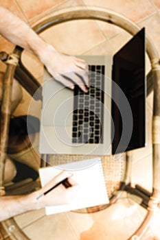 Photo businessman working with notebook. Typing message, hands k