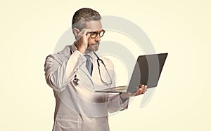 photo of busy emedicine and doctor man with laptop. doctor promoting emedicine