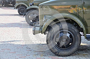 Photo of the cabins of three military off-road vehicles from the times of the Soviet Union. Side view of military cars from the f