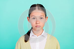 Photo of calm focused dilligent pupil lady serious look camera wear green top cardigan isolated teal color background