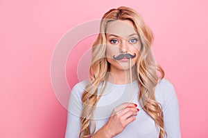 Photo of calm young person hold mustache stick pretending man isolated on pink color background