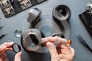 Photo camera lens repair set. Engineer maintenance