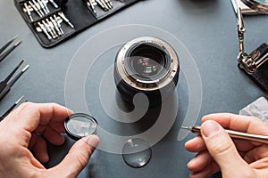 Photo camera lens repair set. Engineer maintenance