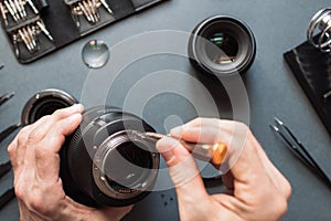 Photo camera lens repair set. Engineer maintenance