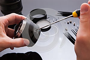 Photo camera lens repair set. Engineer maintenance