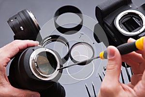 Photo camera lens repair set. Engineer maintenance