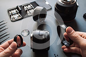 Photo camera lens repair set. Technician engineer