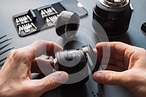 Photo camera lens repair set. Technician engineer