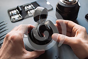 Photo camera lens repair set. Technician engineer