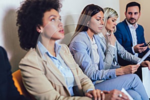 Photo of candidates waiting for a job interview.