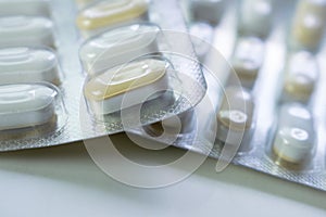 Photo about capsules or tablets or pills for treatement of infection.closeup shot of tablets