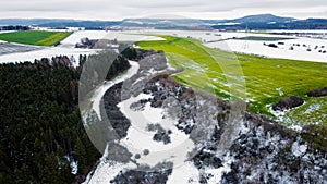 The photo captures a mesmerizing winter landscape as seen from the lofty vantage point of a drone