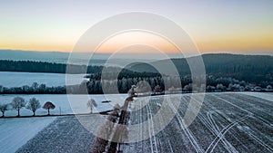 The photo captures a mesmerizing winter landscape as seen from the lofty vantage point of a drone