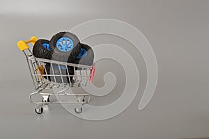 A photo capturing car wheels placed in a shopping cart, symbolizing the thriving car wheel industry worldwide