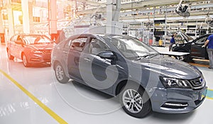 Photo of a car production line. Modern car assembly plant