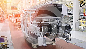 Photo of a car production line. Modern car assembly plant