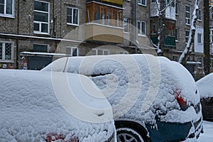 photo of car snow in the parking lot in