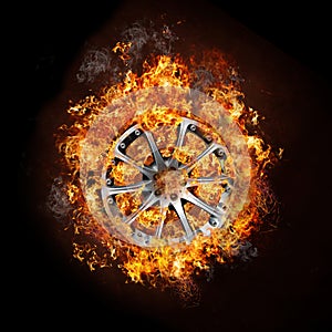 Photo of a car wheel on burning fire