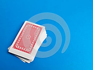 Photo of card games against blue background. Poker games and gambling concept.