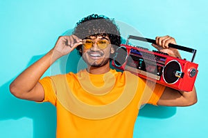 Photo of carefree guy summer vibe listen retro vintage oldschool boombox atmosphere discotheque isolated on aquamarine