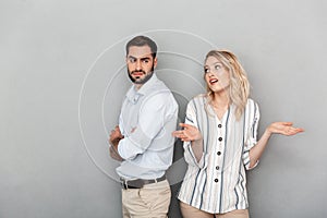 Photo of caucasian couple man and woman in casual clothes making up after fight