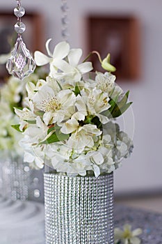 Silver centerpiece with flowers photo