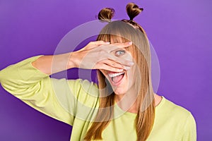 Photo of charming funky young woman dressed green pullover arm cover eye isolated purple color background