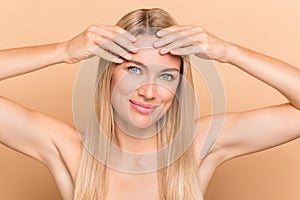 Photo of charming lady have oily dry face skin need hydration peeling lotion  over pastel beige color background