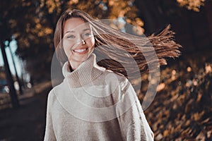 Photo of charming sweet woman wear turtleneck pullover enjoying autumn sunshine outside urban city street