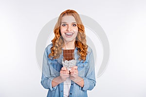 Photo of charming young positive woman amazed hold sweet chocolate smile isolated on grey color background