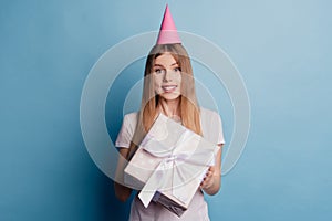 Photo of cheerful adorable cute nice dream lady hold present box wear cone cap on blue color background