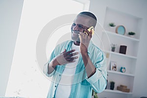 Photo of cheerful aged man answer call smart gadget have family friend interaction in modern house apartment