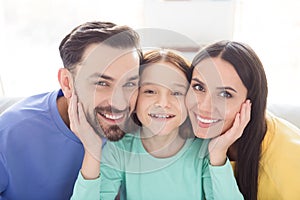 Photo of cheerful attractive family mom dad kid happy positive toothy smile enjoy time together indoors