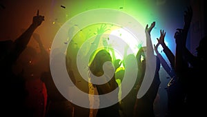 Photo of cheerful bachelorette clubbers buddies enjoy nightlife show air hands up show dancing on disco floor with neon