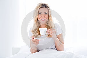 Photo of cheerful beautiful lady lying cozy bed linen quarantine time white sheets blanket amazing energetic morning