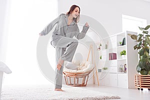 Photo of cheerful cute lady wear grey pajama enjoy weekend dancing indoors house bedroom