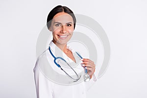 Photo of cheerful good mood young lady doctor dressed uniform smiling arm stethoscope isolated white color background