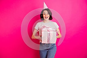 Photo of cheerful nice attractive cute girlfriend holding giftbox with her hands wearing cap gray t-shirt jeans denim