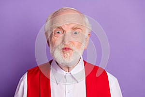 Photo of cheerful old happy positive man good mood make funny face grimace isolated on purple color background