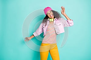 Photo of cheerful positive style casual cute nice pretty carefree girl wearing pants trousers yellow headphones striped