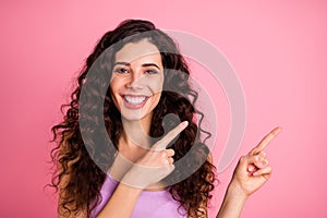 Photo of cheerful pretty charming fascinating kind good girl pointing at your best choice while isolated with pink