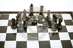 Photo of chess black pawns on the chess board game
