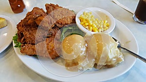 Photo Of Chicken Dinner With Corn And Mashed Potatoes